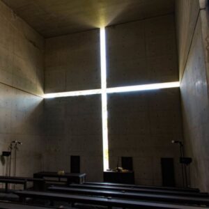 Tadao Ando Church of Light interior concrete wall with cross-shaped opening streaming natural light Osaka Japan