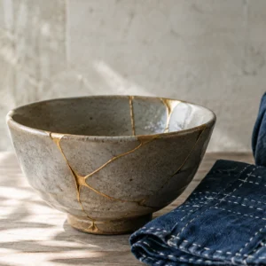 Kintsugi repaired bowl sashiko mended cloth and furoshiki wrapped gift three Japanese arts embodying mottainai philosophy